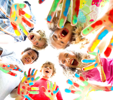 smiling kids with colourfull hands