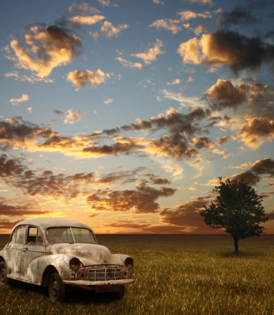 An Old Abandoned Car with Sunset